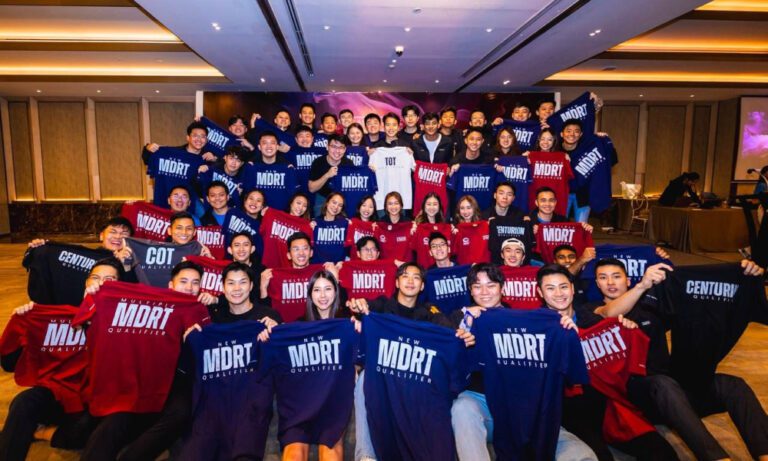 Attendees at the MDRT awards presentation wearing custom cotton tees by Imprint Singapore.