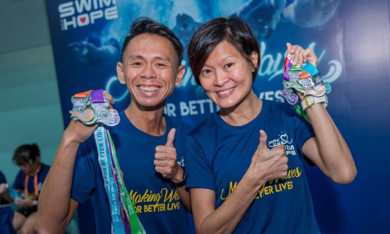 Medalists at SAFRA Swim for Hope event wearing Imprint Singapore's custom Dri-Fit tees.