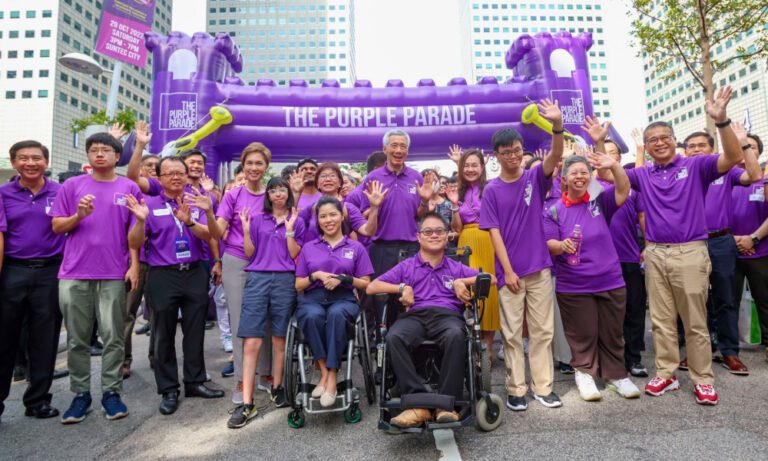 Group photo at The Purple Parade featuring PM Lee Hsien Loong wearing a custom shirt by Imprint Singapore